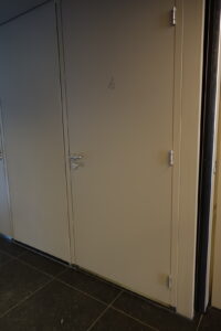 The disabled restroom is on the ground floor. It is marked with an image of a wheelchair, and has a lever door handle.