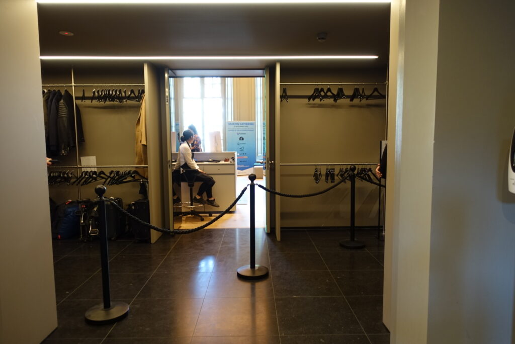 When entering the building from the front entrance (Keizersgracht street), the second right (beyond the reception) is the coat check room. From inside the coat check, a left turn leads to the disabled restroom.
