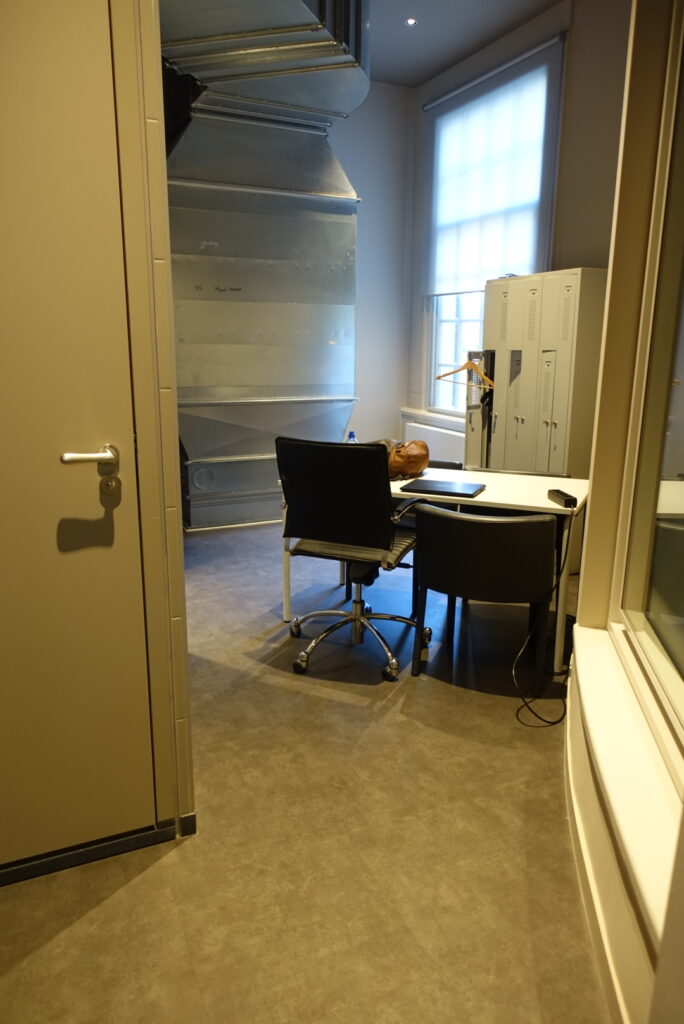 The accessibility team and the conference staff can help you to access the quiet room. It contains a desk with two chairs, a bright window that can be dimmed with a sheer cover, and a private internal restroom.